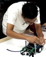 image of student with Lego robot